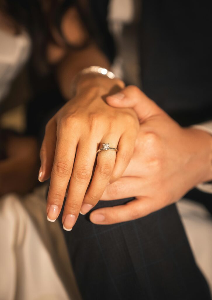 pexels-photo-25396063-25396063 Close-up of a couple's hands with an elegant engagement ring, showcasing love in Oaxaca, Mexico.